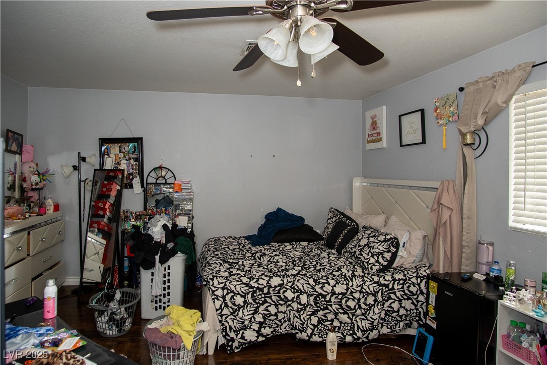 3844 Fitzpatrick Drive Las Vegas, NV 89115 - Photo 9 of 23 Bedroom featuring dark wood-type flooring and a ceiling fan
