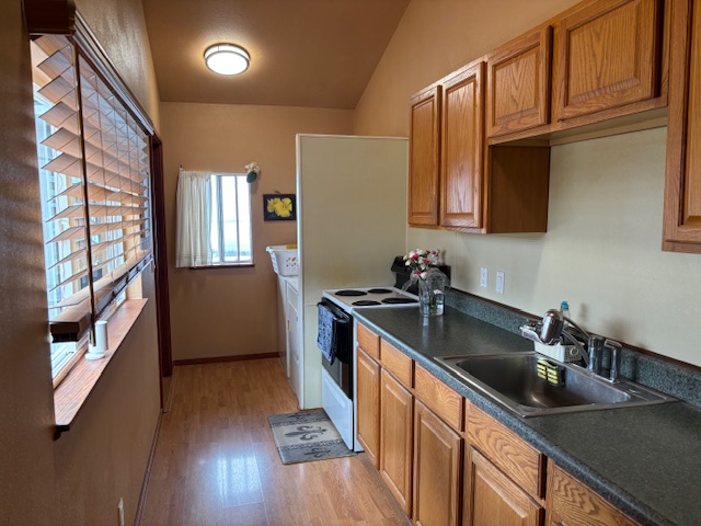 92-8564 Koa Lane Ocean View, HI 96704 - Photo 11 of 30 a kitchen with stainless steel appliances granite countertop a sink stove and cabinets