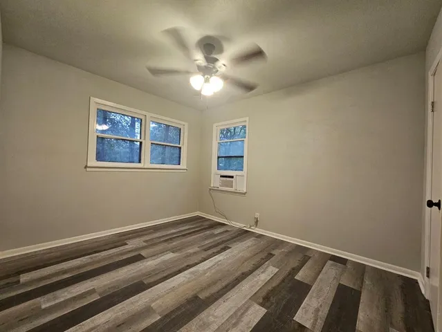 a view of room with window and ceiling fan