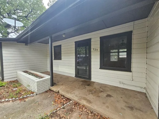 a front view of a house with white door