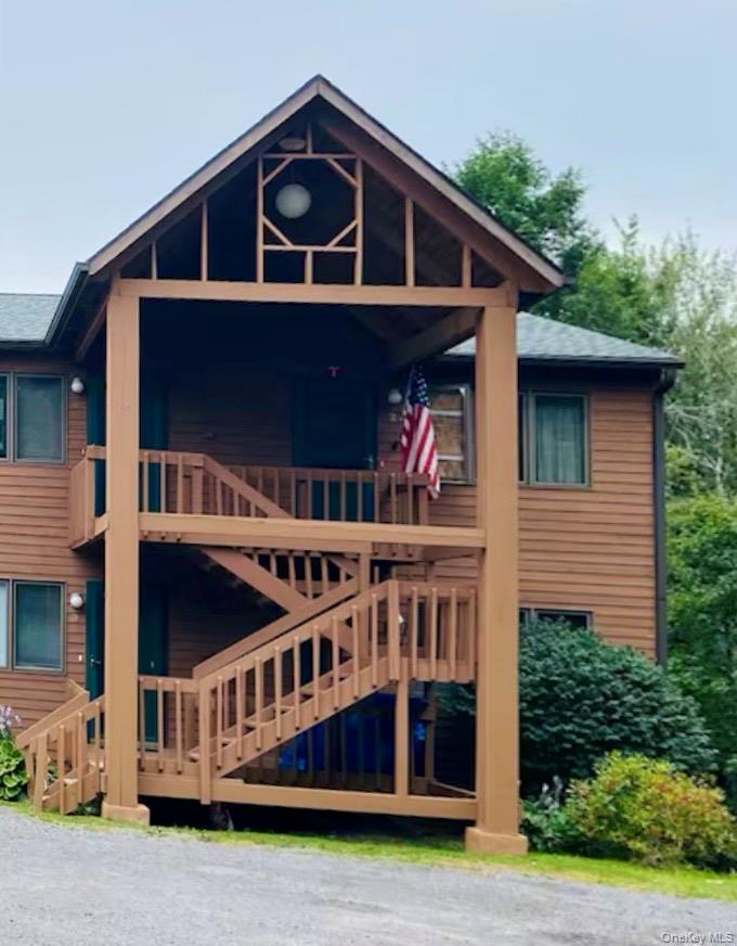 a view of a house with brick walls and deck