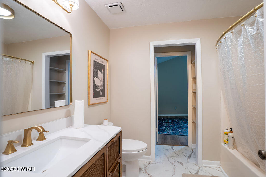 7 Timberlake Drive Jackson, TN 38305 - Photo 13 of 38 a bathroom with a sink toilet and shower