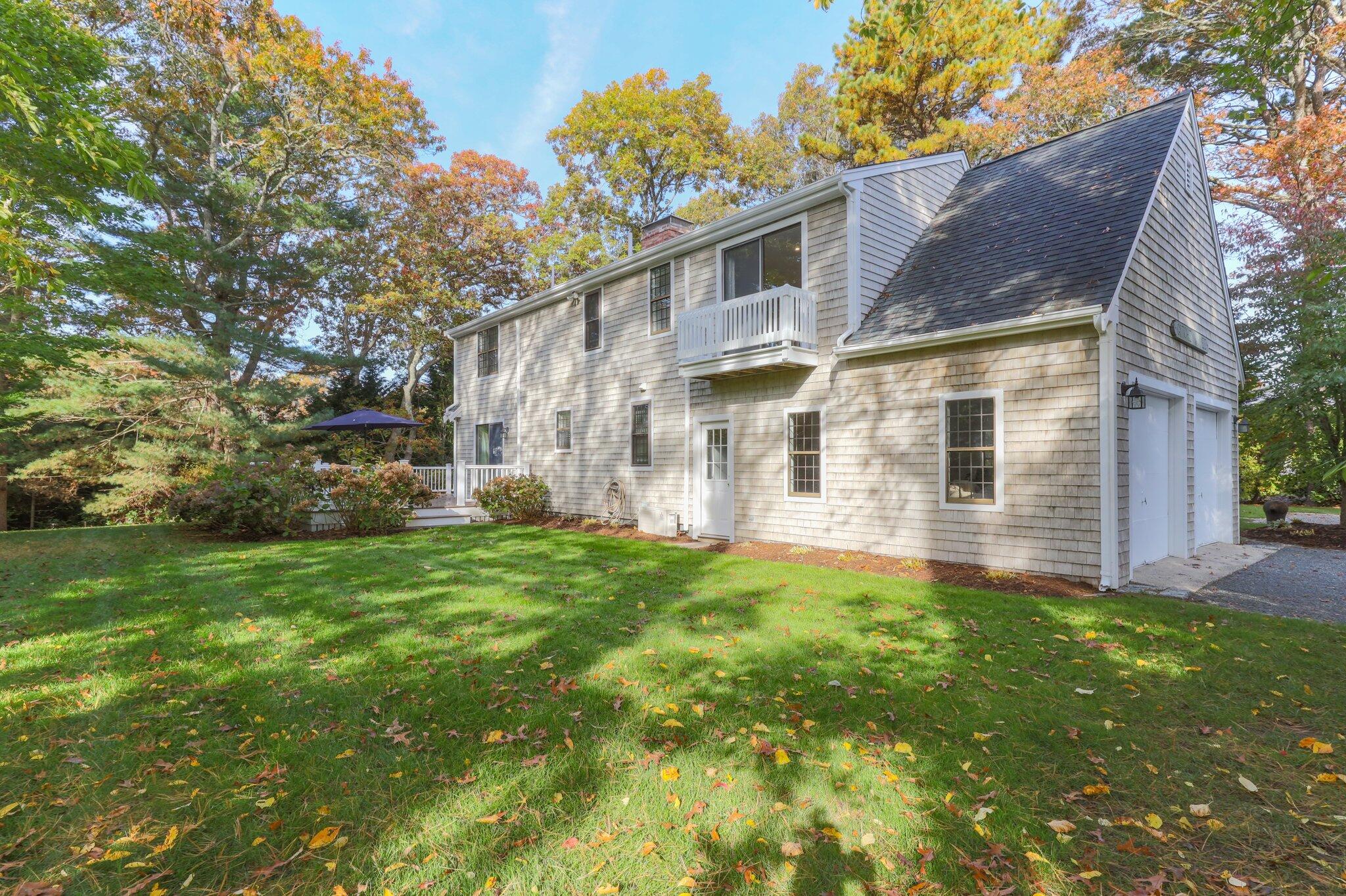 33 Waterfield Road Osterville, MA 02655 - Photo 38 of 40 front view of a house with a yard