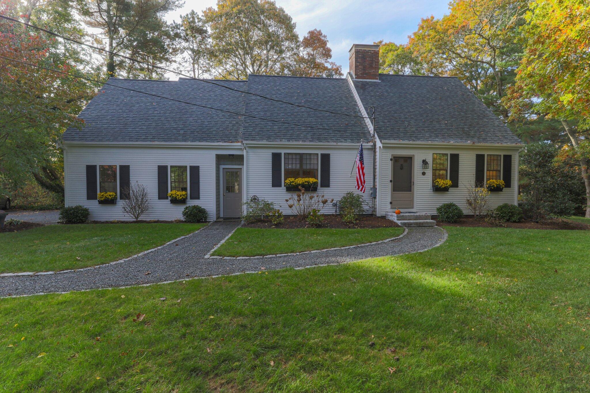 33 Waterfield Road Osterville, MA 02655 - Photo 4 of 40 a front view of house with yard and green space