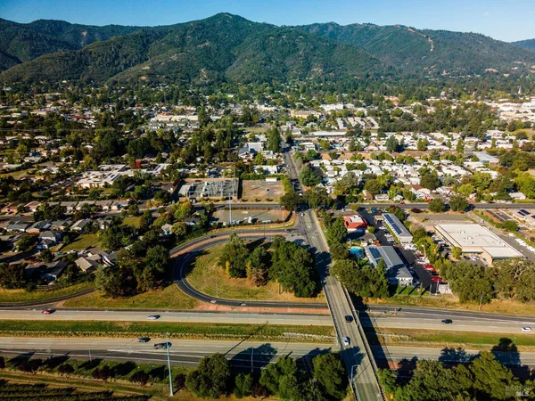 a view of a town with mountains in the background