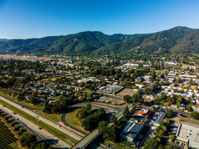 an aerial view of residential houses and outdoor space