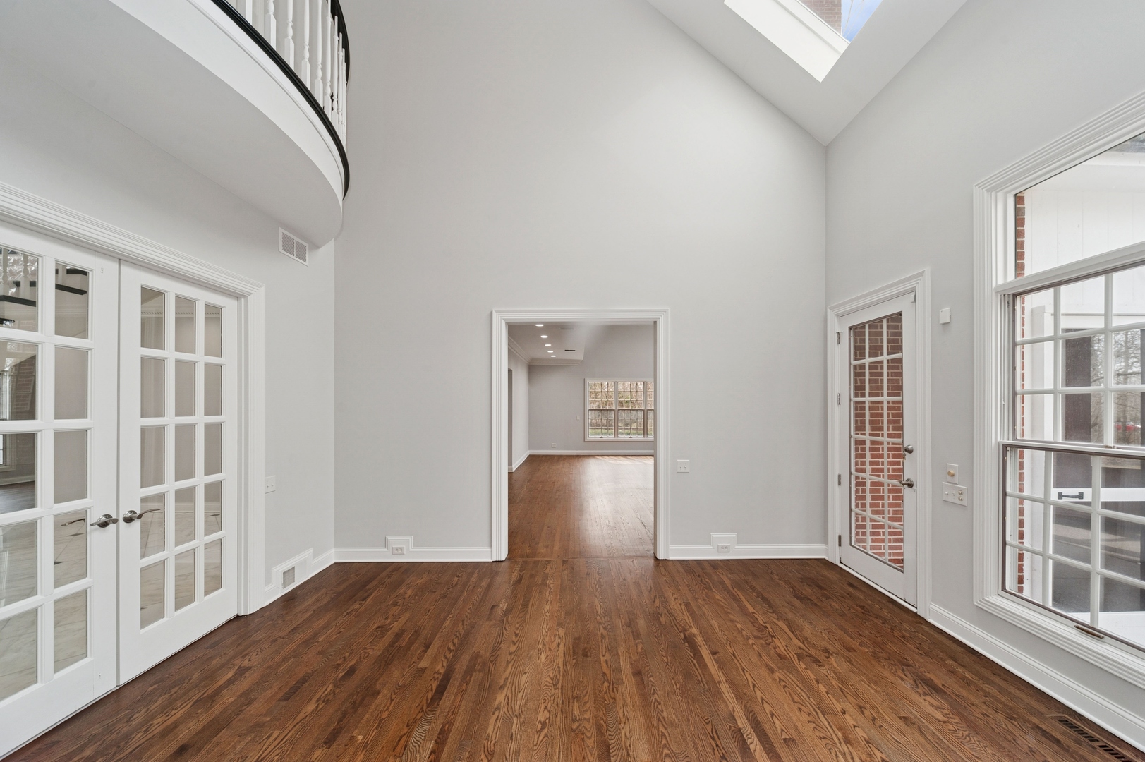 600 Broadsmoore Drive Lake Forest, IL 60045 - Photo 11 of 26 a view of an empty room with wooden floor and windows