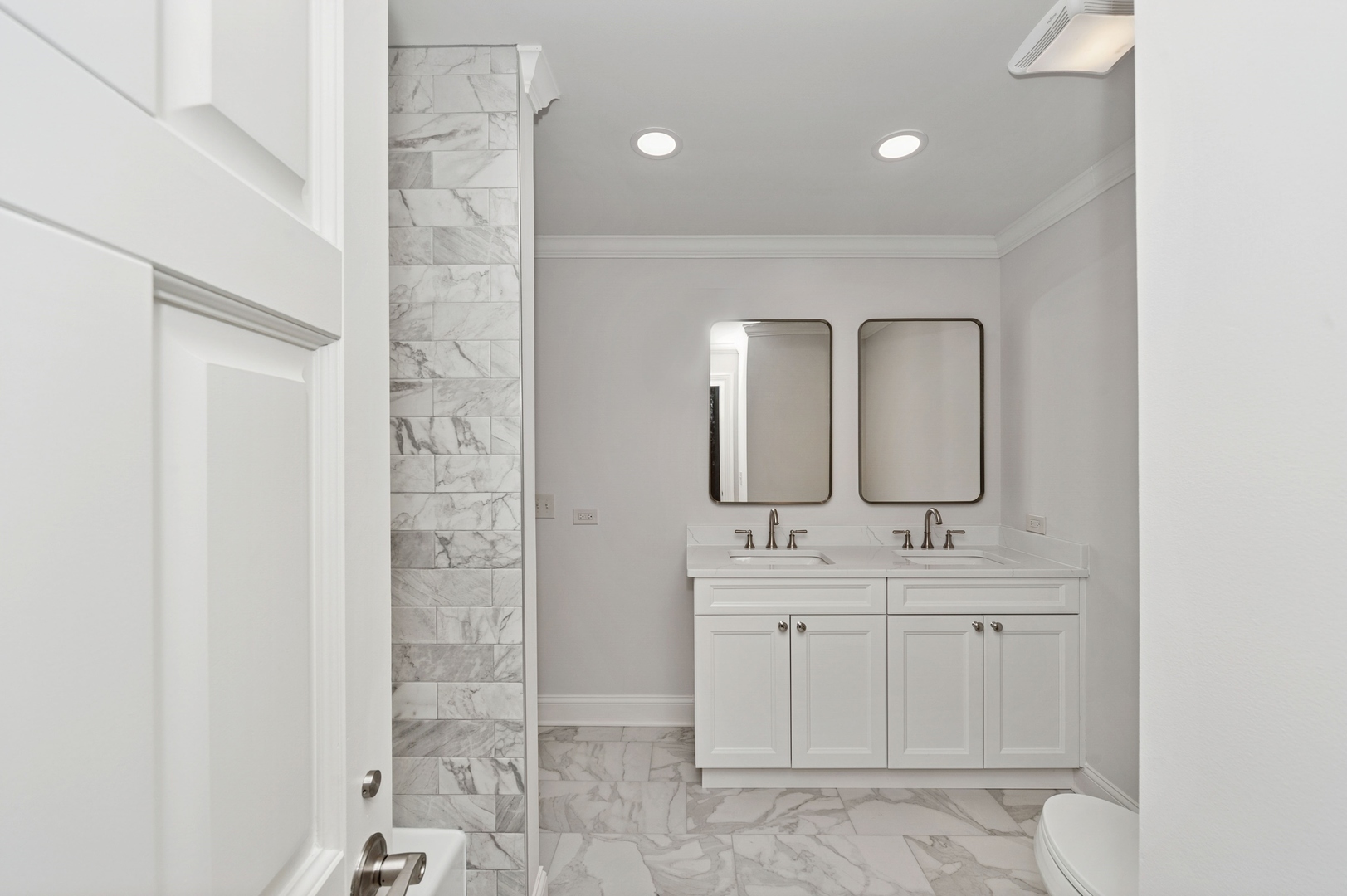 600 Broadsmoore Drive Lake Forest, IL 60045 - Photo 21 of 26 a bathroom with a double vanity sink a mirror and a shower
