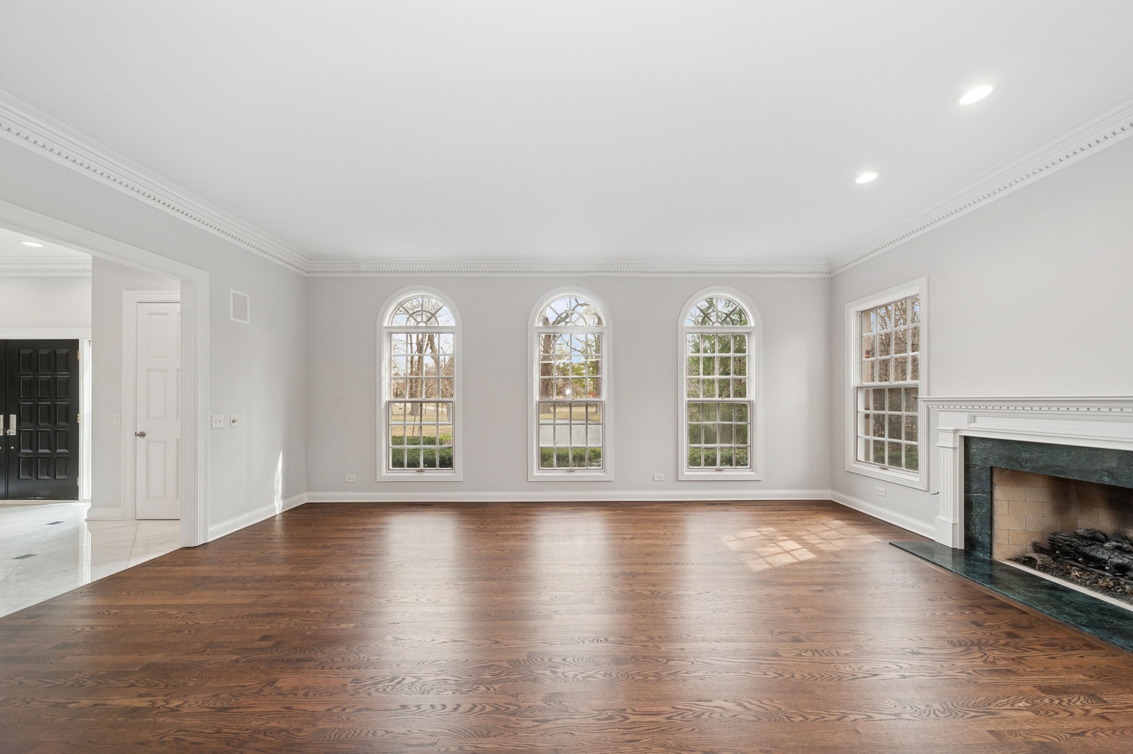 600 Broadsmoore Drive Lake Forest, IL 60045 - Photo 5 of 26 a view of an empty room with wooden floor and a fireplace