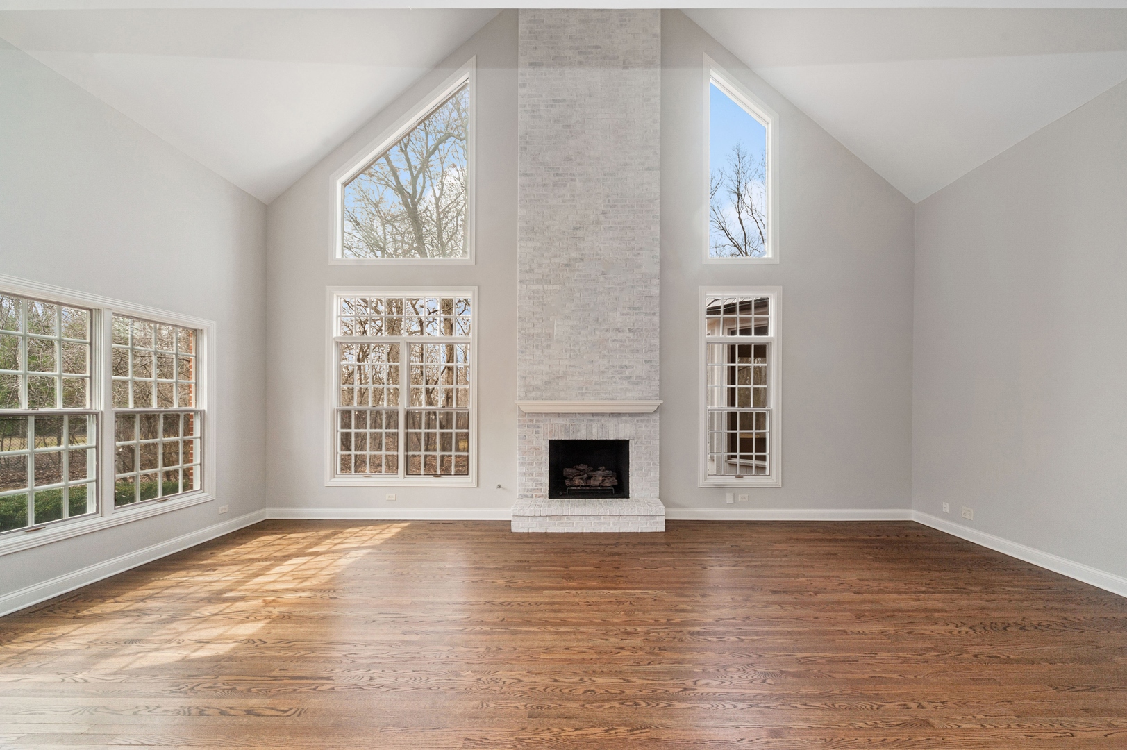 600 Broadsmoore Drive Lake Forest, IL 60045 - Photo 8 of 26 a view of an empty room with wooden floor and a window