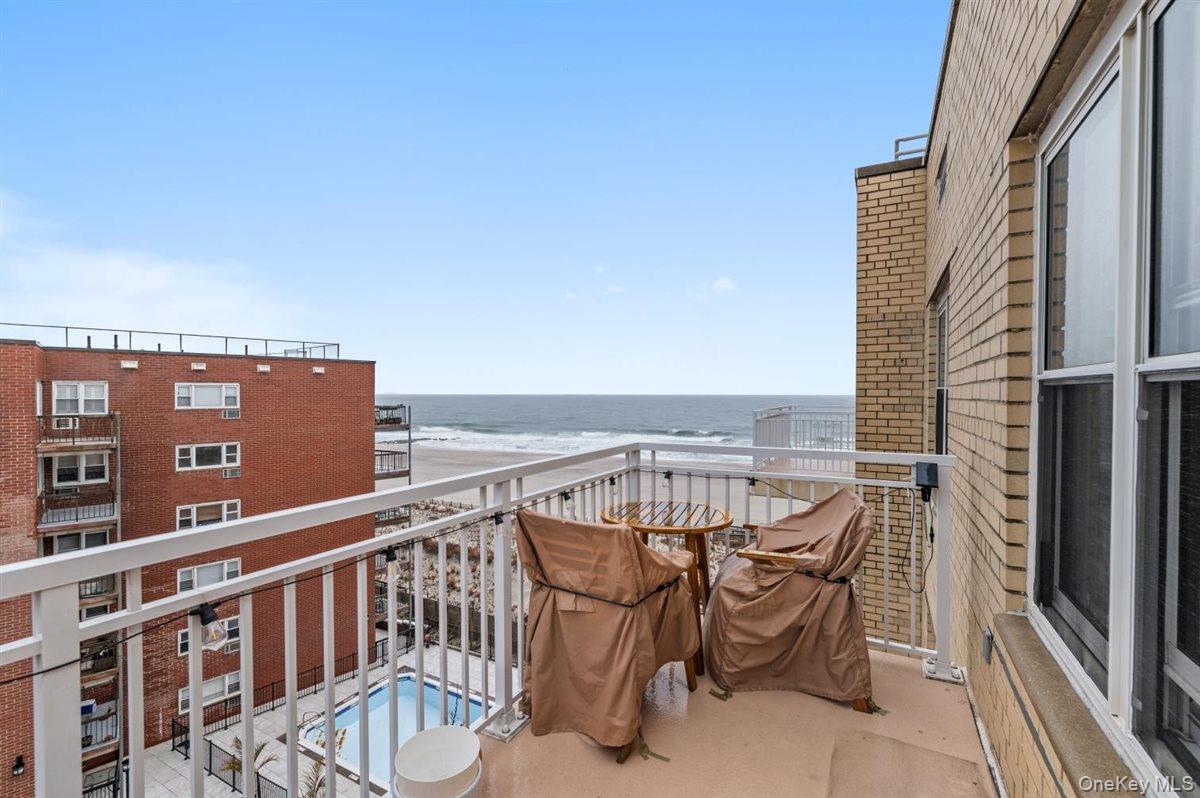 700 Shore Road, Unit 7Y Long Beach, NY 11561 - Photo 30 of 31 Balcony featuring view of pool and a water view