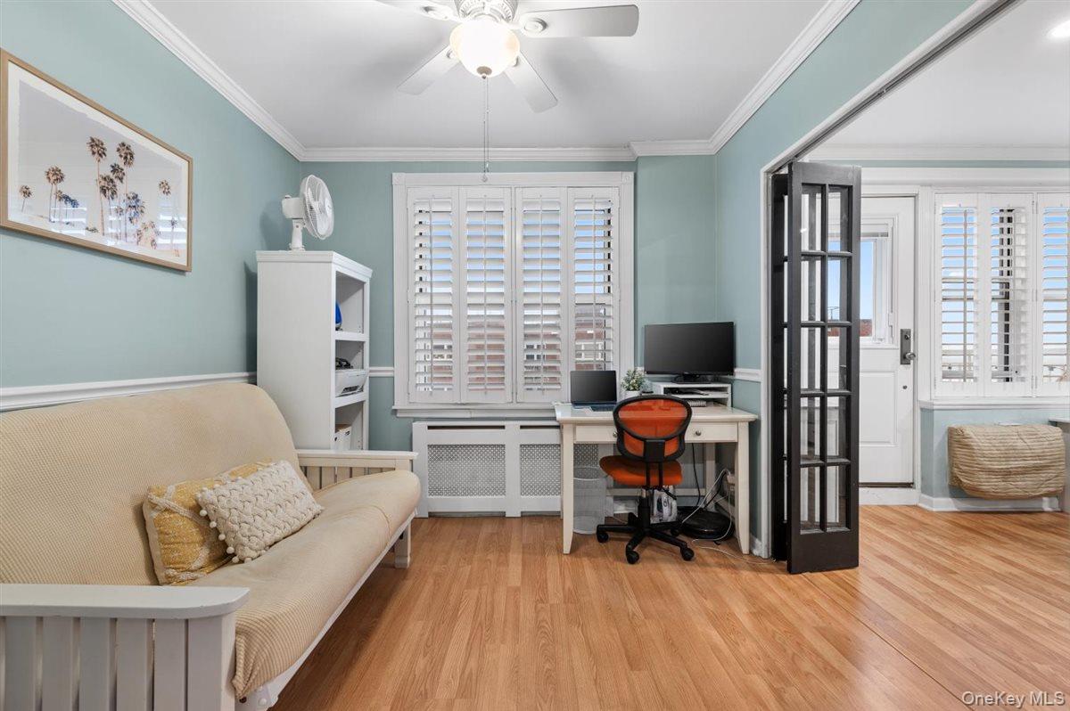 700 Shore Road, Unit 7Y Long Beach, NY 11561 - Photo 6 of 31 Office with radiator heating unit, a ceiling fan, wood finished floors, and ornamental molding