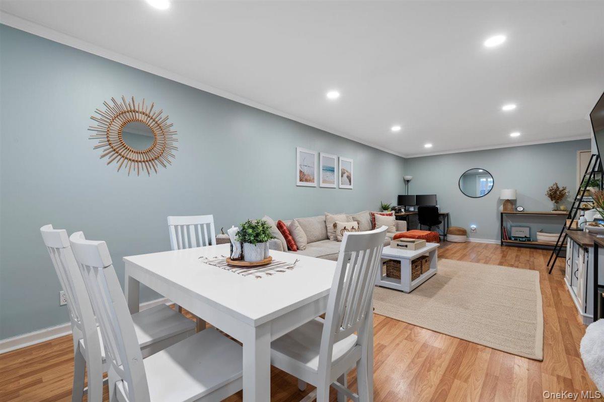 700 Shore Road, Unit 7Y Long Beach, NY 11561 - Photo 9 of 31 Dining area featuring recessed lighting, ornamental molding, and light wood-type flooring
