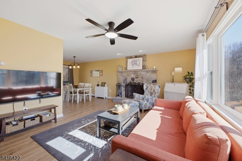 7 Summer Street Columbia, NJ 07832 - Photo 4 of 22 a living room with furniture a flat screen tv and a window