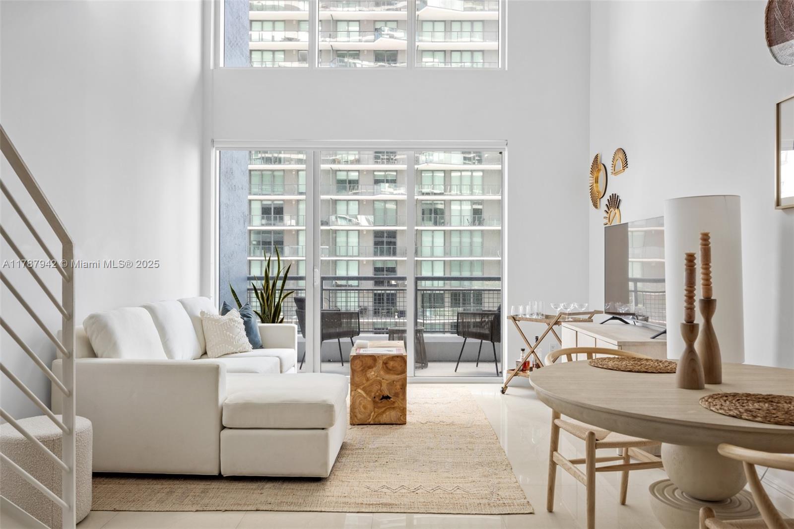 60 Southwest 13th Street, Unit 3414 Miami, FL 33130 - Photo 1 of 24 a living room with furniture