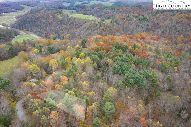an aerial view of houses with yard