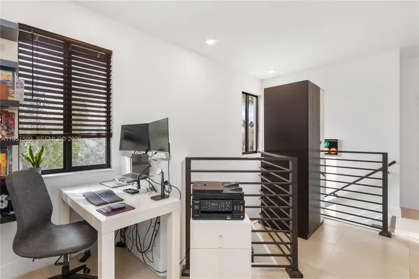 a kitchen with a table and chairs