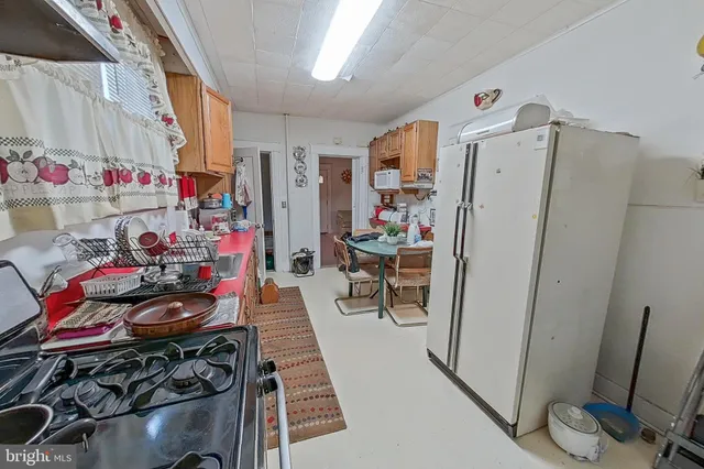 a view of a room with furniture and rug