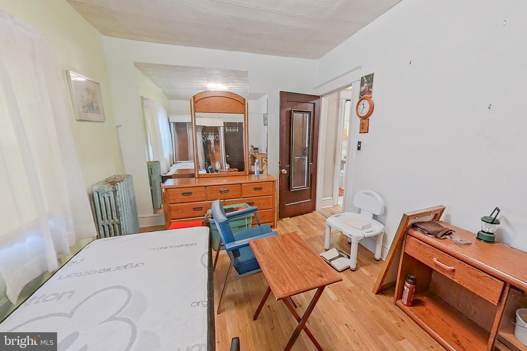 2803 Ruscombe Lane Baltimore, MD 21215 - Photo 19 of 28 a bedroom with furniture and a window