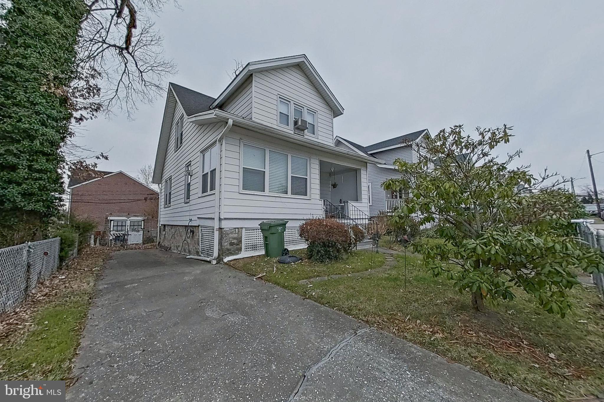 2803 Ruscombe Lane Baltimore, MD 21215 - Photo 2 of 28 a front view of a house with garden