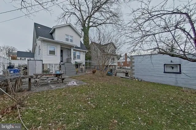 a view of a town with brick house in the background