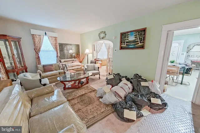 a very nice looking living room with furniture and a large window