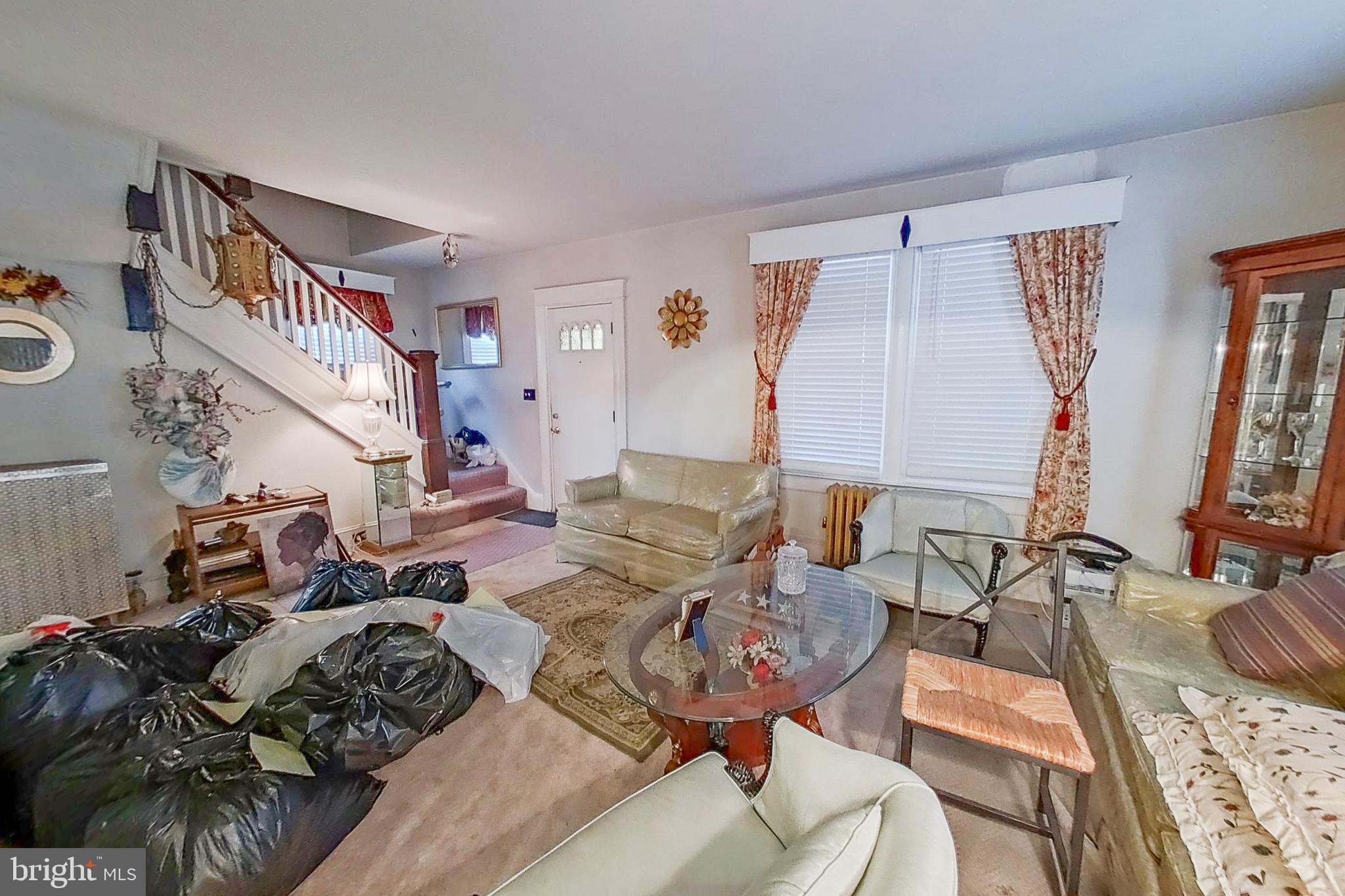 2803 Ruscombe Lane Baltimore, MD 21215 - Photo 6 of 28 a very nice looking living room with furniture and a large window