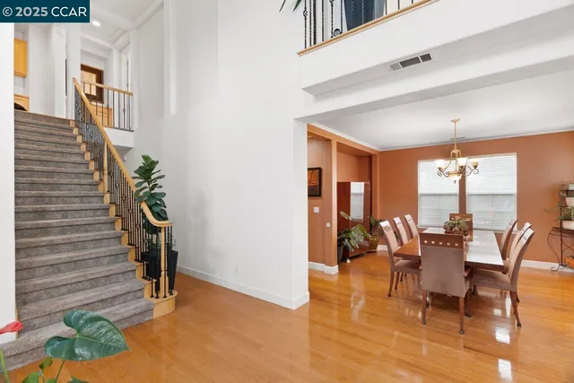 a kitchen with stainless steel appliances a refrigerator and a stove top oven