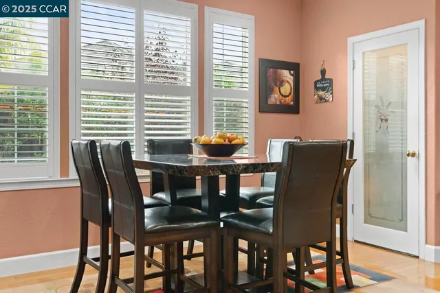 a living room with a couch a fireplace and a large window
