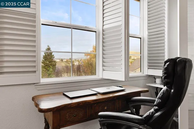 a view of a kitchen with wooden floor