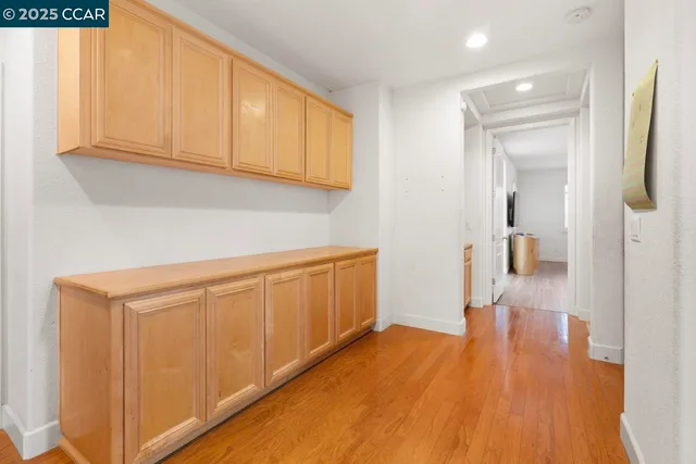 a bedroom with a bed and a potted plant