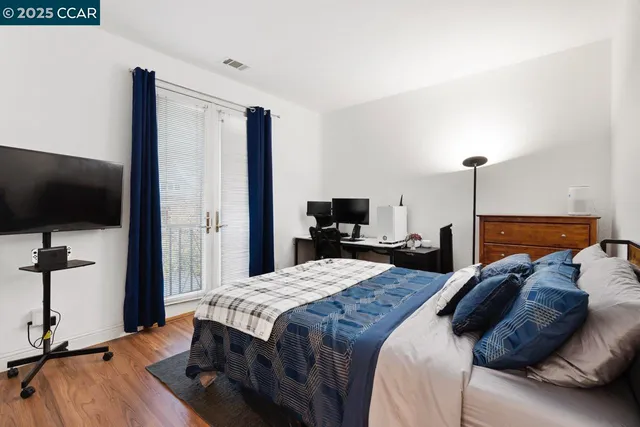 a bathroom with a sink mirror and toilet