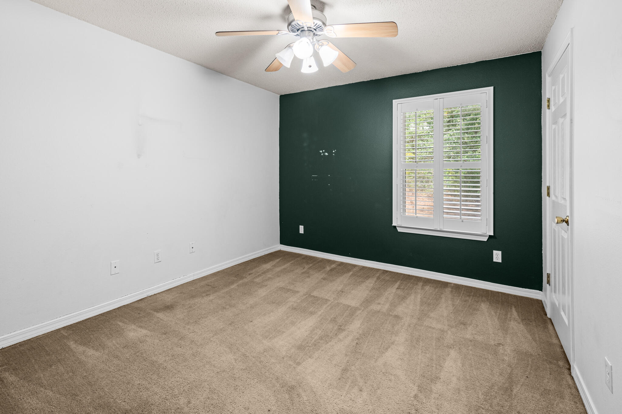 233 Lustan Drive Crestview, FL 32536 - Photo 18 of 22 an empty room with a window and a fan