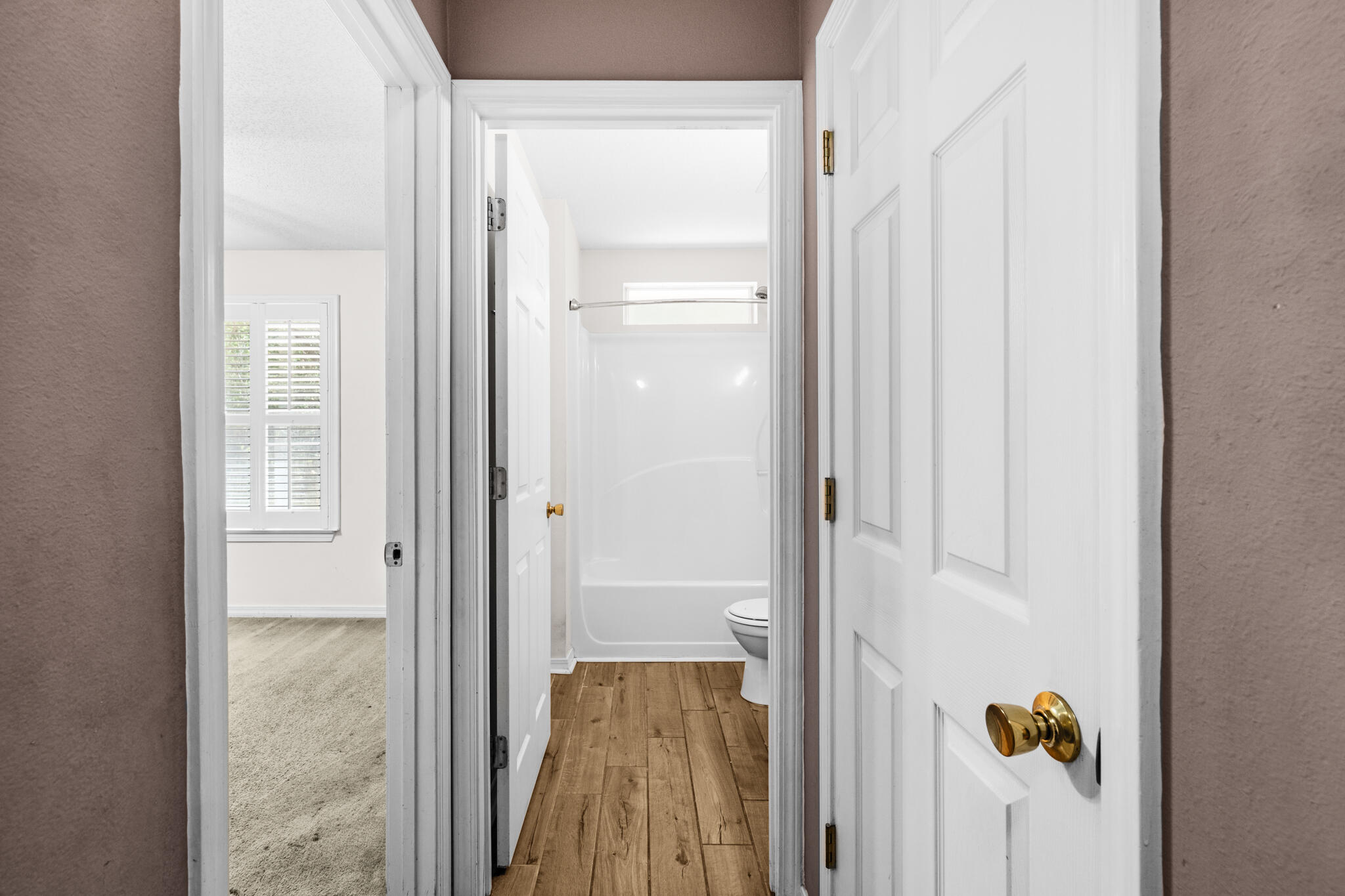 233 Lustan Drive Crestview, FL 32536 - Photo 20 of 22 a view of hallway with wooden floor