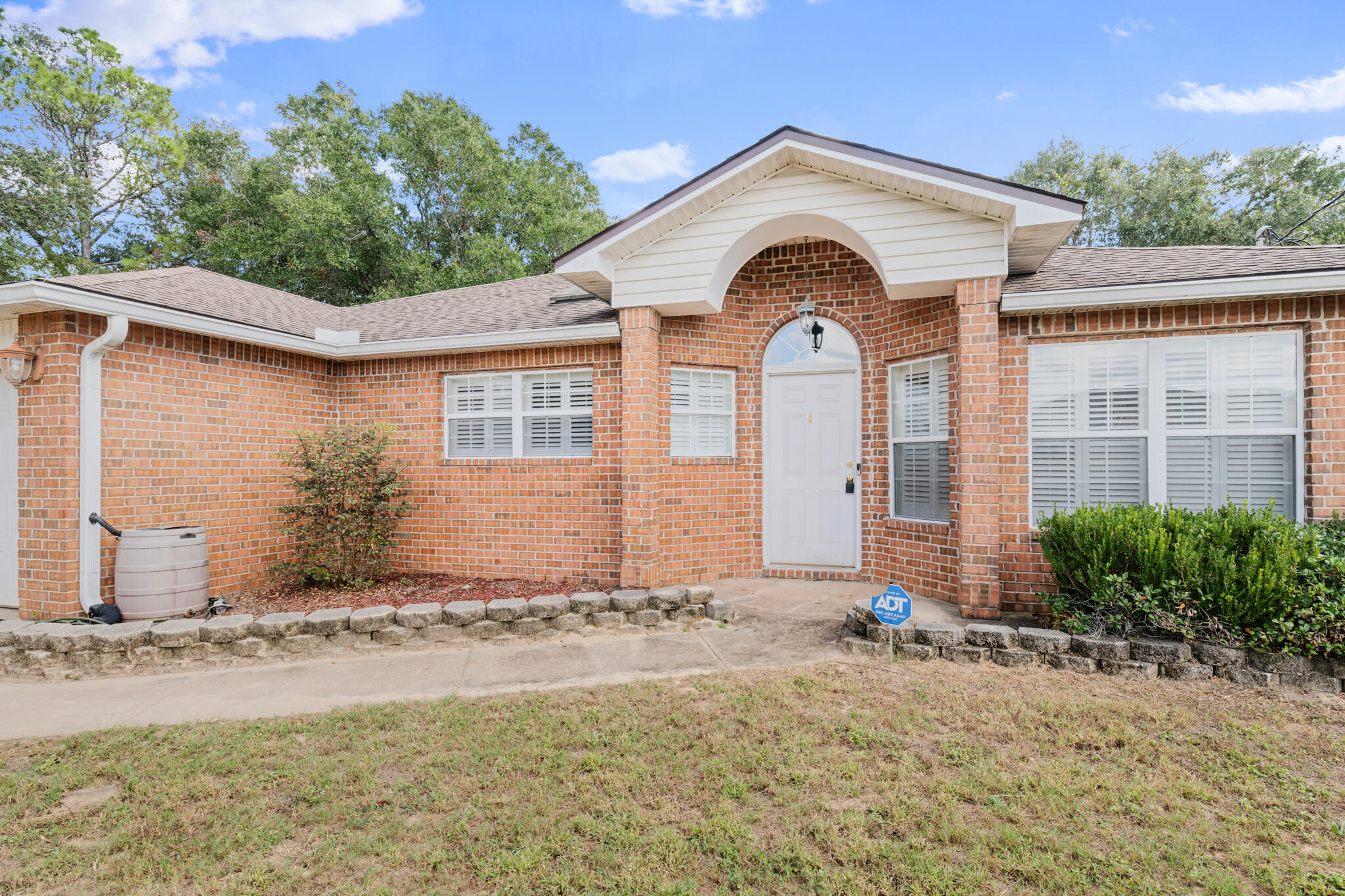 233 Lustan Drive Crestview, FL 32536 - Photo 3 of 22 a front view of a house
