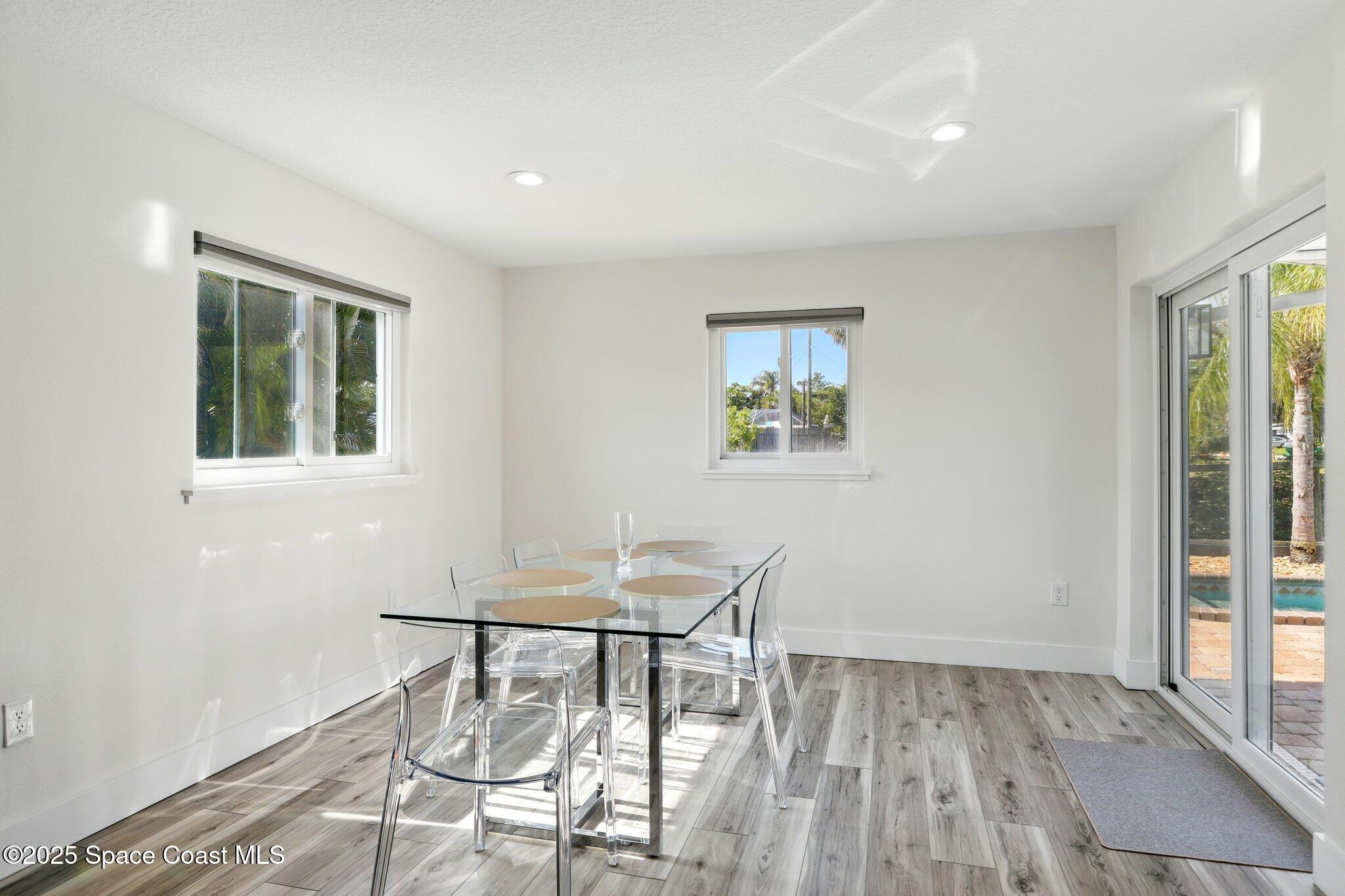 135 Richland Avenue Merritt Island, FL 32953 - Photo 18 of 24 a view of a dining room with furniture and wooden floor