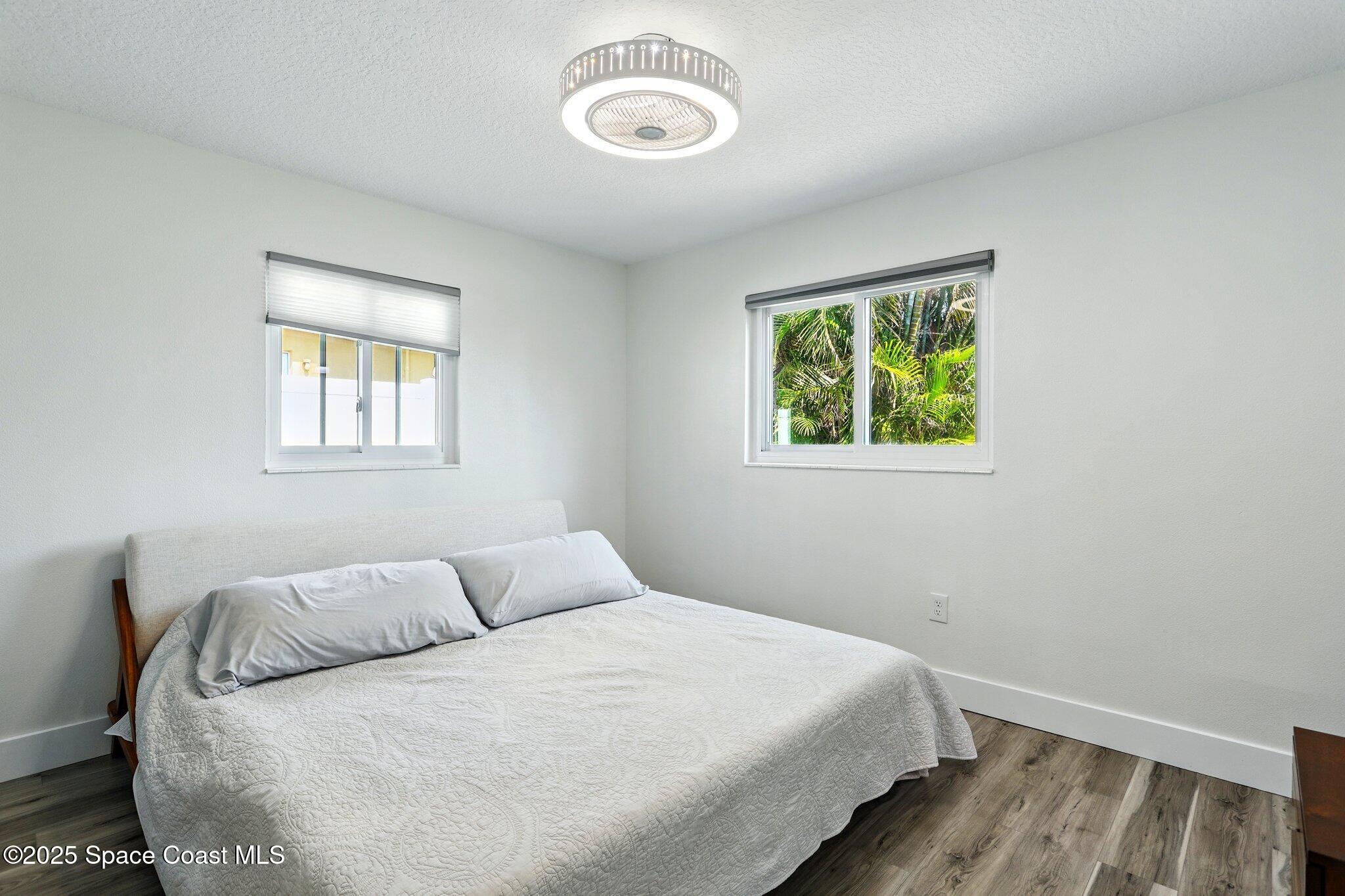 135 Richland Avenue Merritt Island, FL 32953 - Photo 19 of 24 a bedroom with a bed and a window