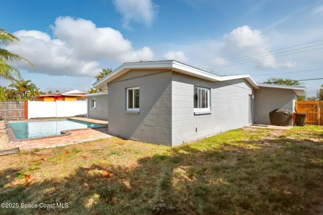 a house view with a backyard