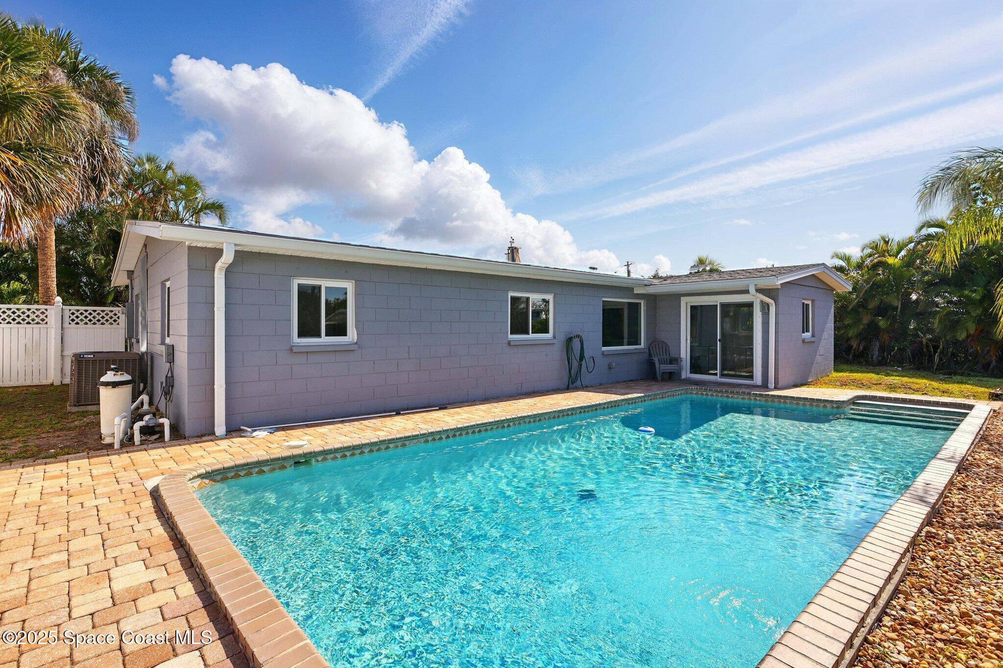 135 Richland Avenue Merritt Island, FL 32953 - Photo 9 of 24 a backyard of a house with seating space