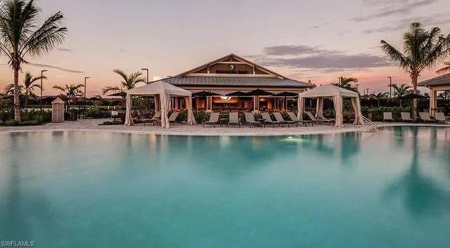 a view of a building with river in front of it