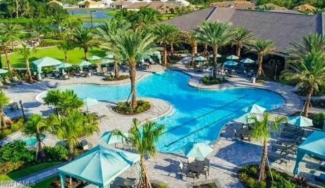a view of a backyard with plants and patio