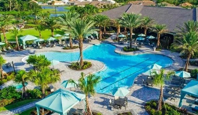 15335 Lucerna Street, Unit 104 Naples, FL 34114 - Photo 2 of 44 a view of a backyard with plants and patio