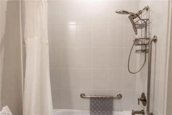 a bathroom with a glass shower door