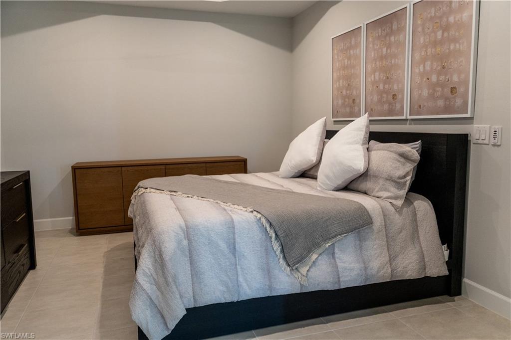 15335 Lucerna Street, Unit 104 Naples, FL 34114 - Photo 30 of 44 a bedroom with a bed and window