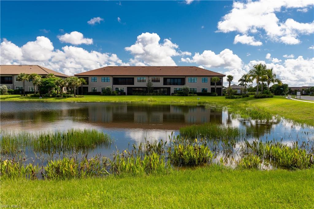 15335 Lucerna Street, Unit 104 Naples, FL 34114 - Photo 36 of 44 a view of a house with a yard