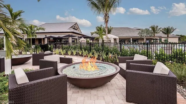 a view of a patio with couches table and chairs