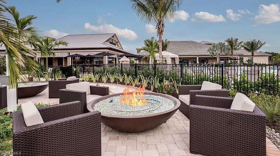 15335 Lucerna Street, Unit 104 Naples, FL 34114 - Photo 39 of 44 a view of a patio with couches table and chairs