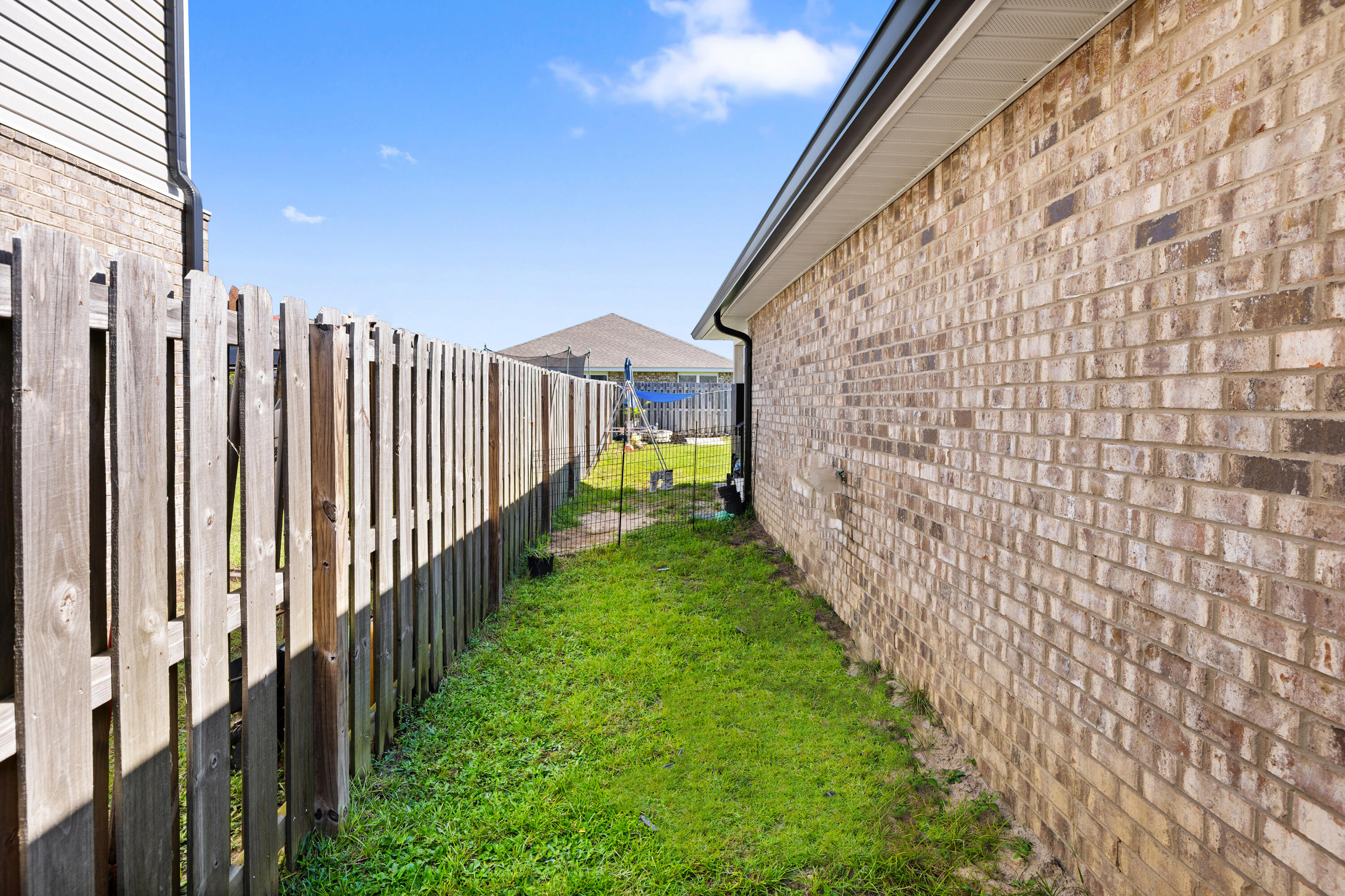 1016 Limpkin Street Crestview, FL 32539 - Photo 14 of 60 a view of a pathway of a building with a street view