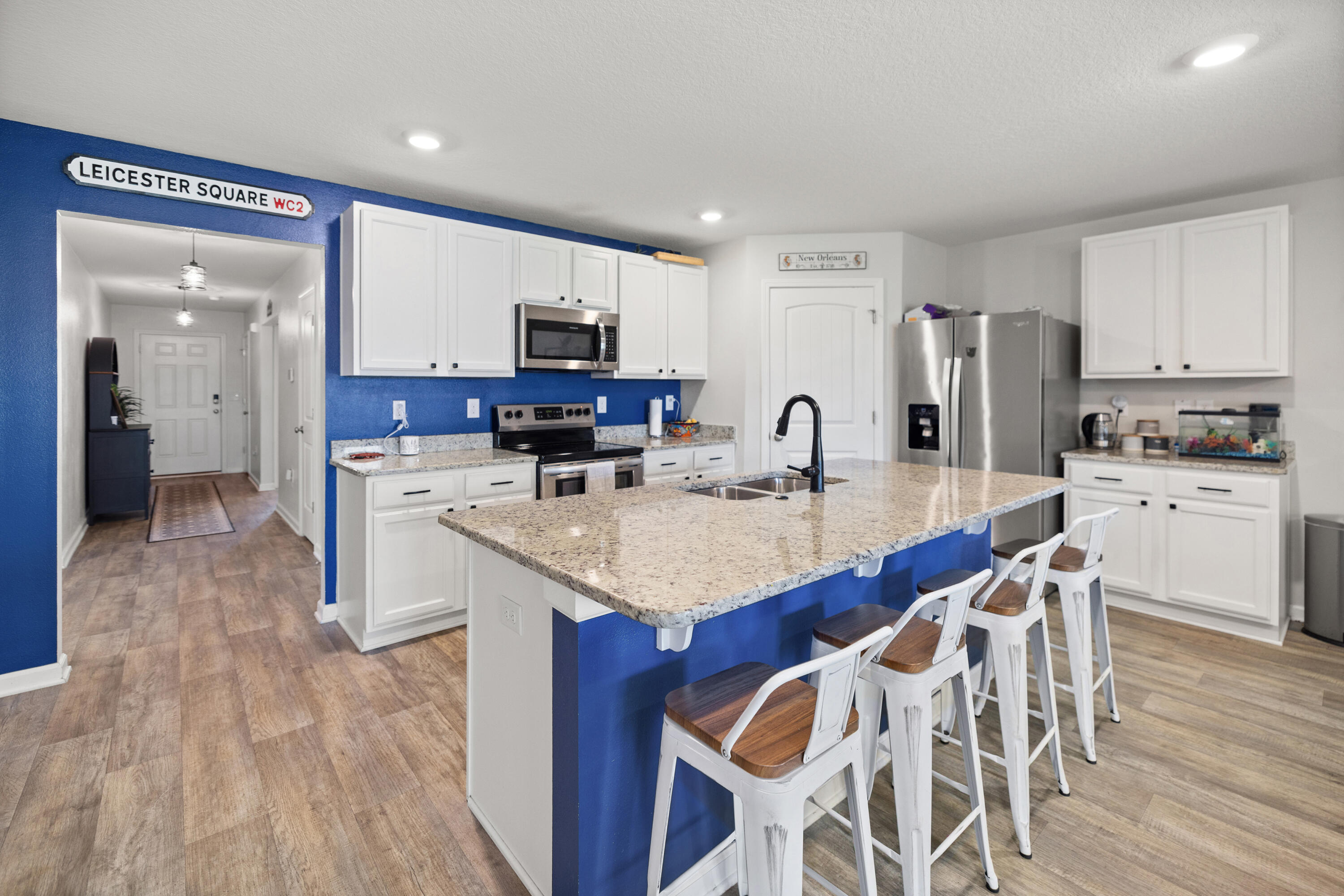 1016 Limpkin Street Crestview, FL 32539 - Photo 21 of 60 a kitchen with stainless steel appliances kitchen island granite countertop a sink and cabinets