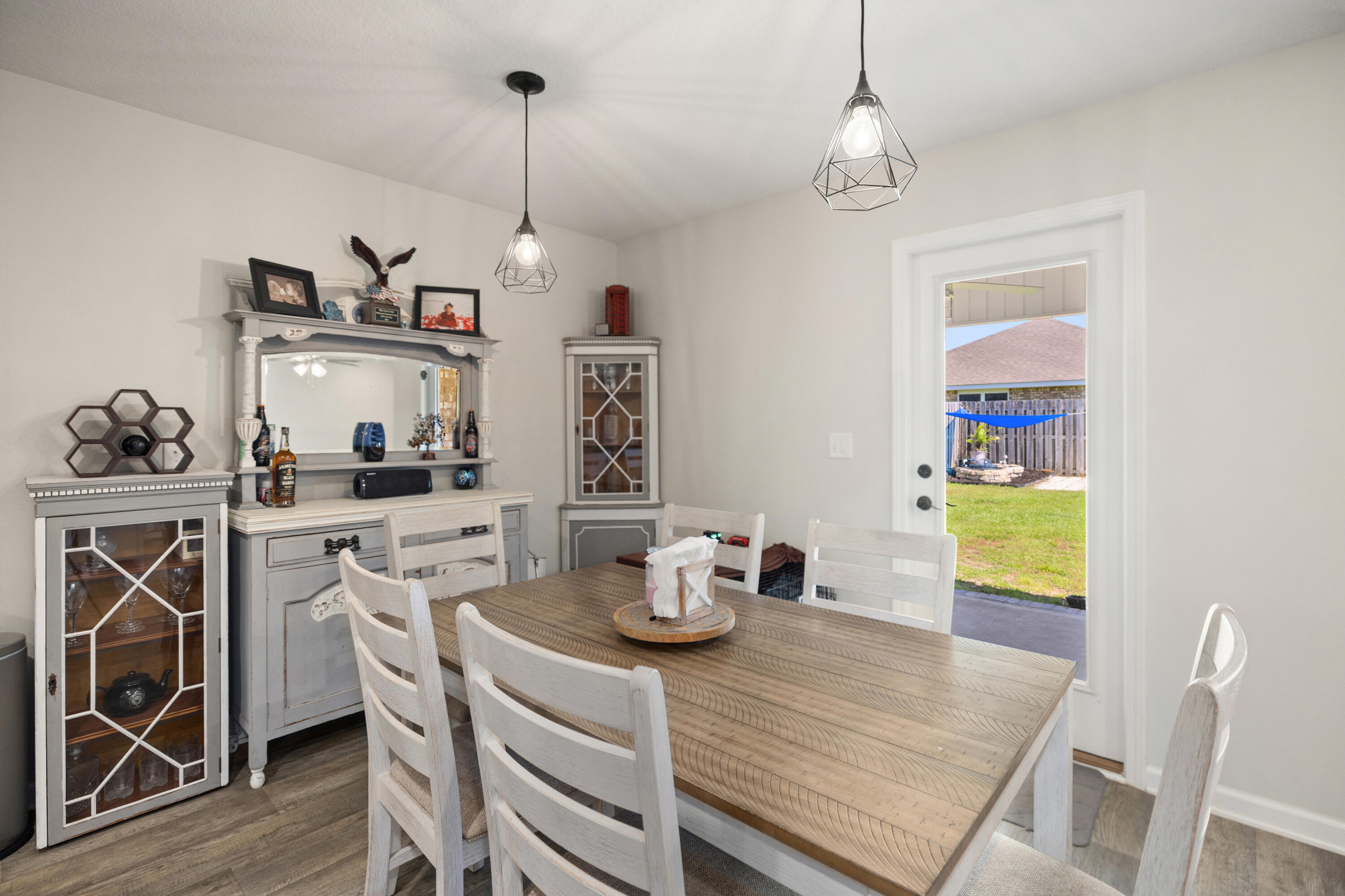 1016 Limpkin Street Crestview, FL 32539 - Photo 24 of 60 a kitchen with a table and chairs in it